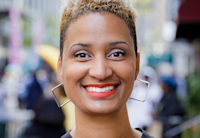 A close-up photo of Aisha Glover, who is smiling.