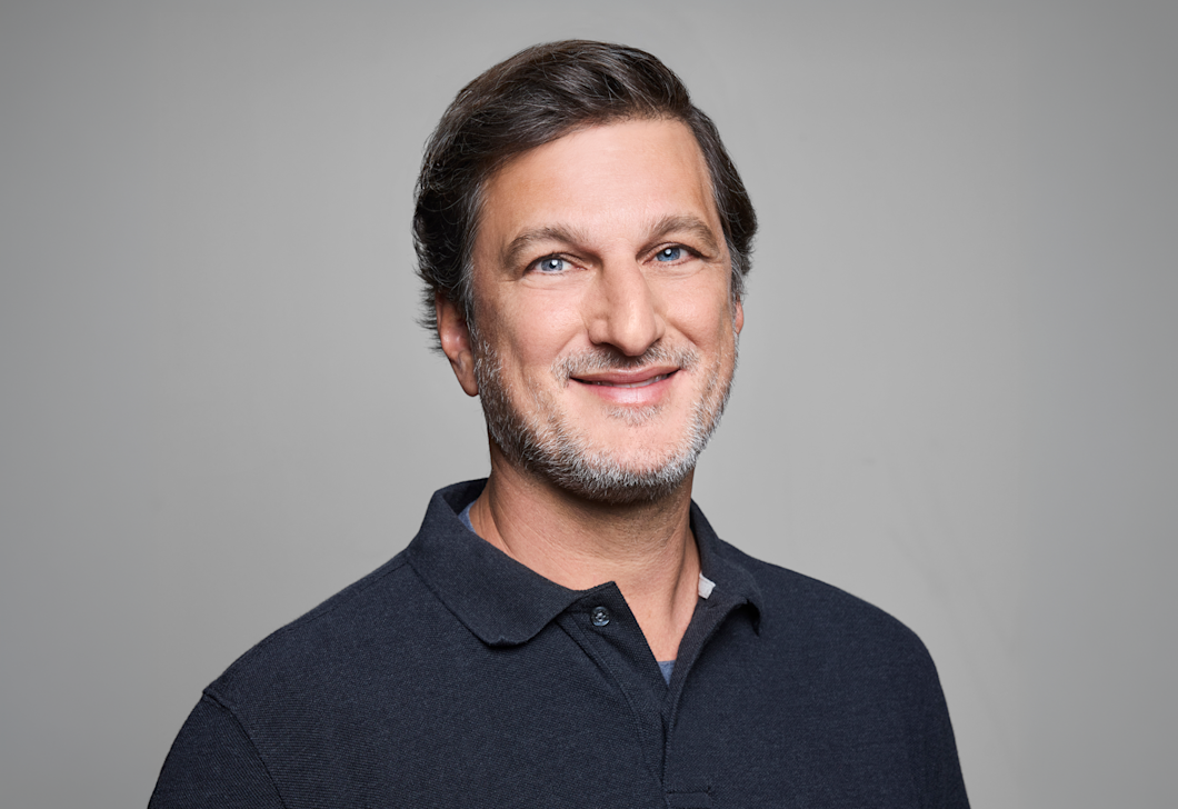 A headshot of Marshall Lewy.