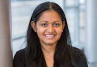 A headshot of Sue Shlapakovsky. She's smiling and wearing a black shirt.