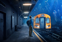 A person stands on a subway platform, facing a train partially submerged in an underwater scene with jellyfish swimming around, creating an Audible experience that leaves more to imagine.