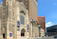 Audible's Innovation Cathedral is in the foreground of a Newark street scene with Audible's other office buildings in the background.