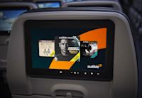 a tv screen on a seat in an airplane