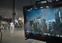 a video shoot set with actors on screen