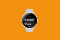 a smart watch with a screen on it showcasing Audible logo and titles
