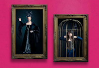 Framed images of Kate McKinnon and Emily Lynne in costume hanging on a hot pink wall