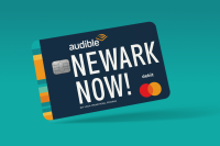 The Audible Bucks Visa card with the words "Newark Now!" is displayed on a teal blue background.