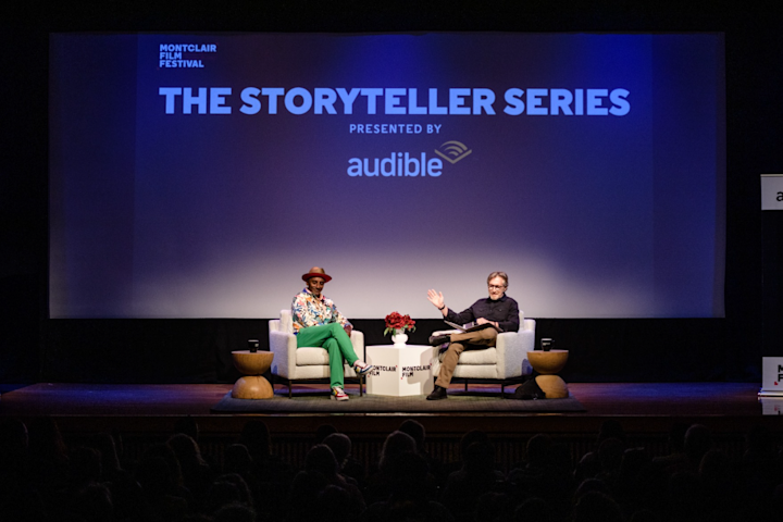 Marcus Samuellson and Don Katz sitting in chairs on stage.