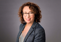 A photo of Audible's General Counsel Lori Landew. She is looking directly at the camera smiling.