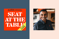 The cover for "Seat at the Table" which is red and white is on a blue background, next to a headshot of Chef Marcus Samuelsson. 
