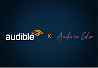 Audible and Audio in Color's logos on a dark background.