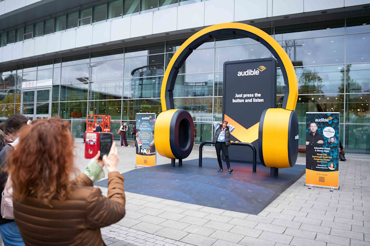 A photo of a headphone-shaped Audible listening station at Frankfurt Book Fair.