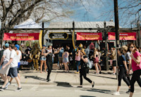 A large crowd of people in front of Audible's SXSW event