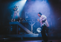 Brian Quijada and Nygel D. Robinson performing "Mexodus" onstage.