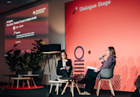 Audible's Chief Content Officer, Rachel Ghiazza, is seated onstage for her panel at Frankfurt Book Fair. On her left is Erin Cox of "Publishing Perspectives," who's moderating.