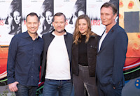 The four lead actors from "Auris," a new Audible Germany release, pose together against the audiobook cover.