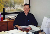 Rick Lewis at his desk in 1996