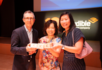 A photo of Bob Carrigan, Shima Osaka, and Cynthia Chu at the celebration for Audible's 10-year anniversary of its service for Japan.
