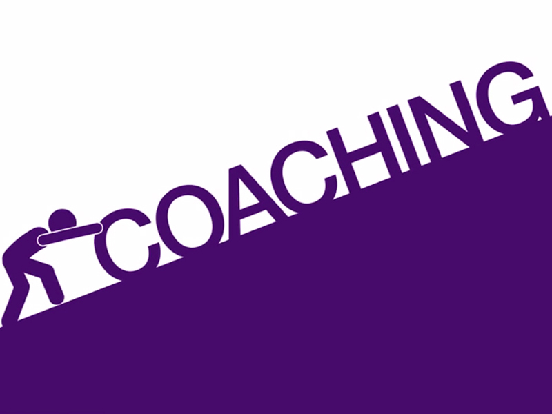 human icon pushing the words 'coaching' up a hill