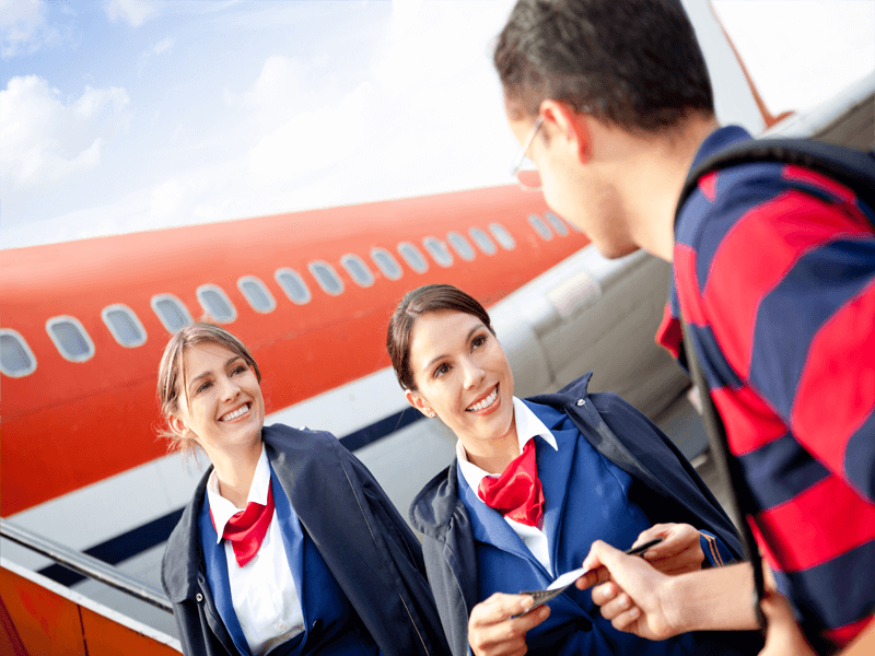 Airline staff greeting a customer