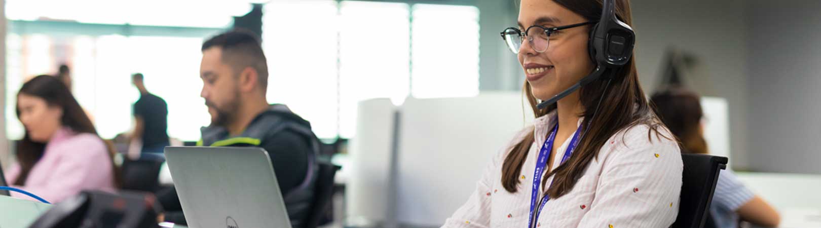 Call center employee sitting at her desk