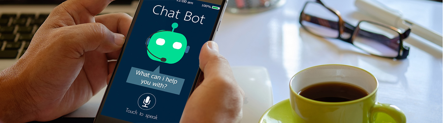 Person holding a phone that has a chatbot app open