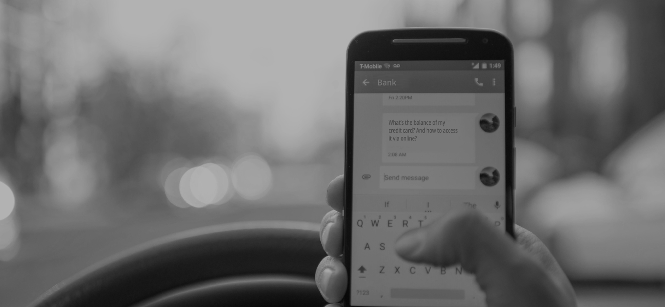 person holding phone and texting with a chatbot about banking info