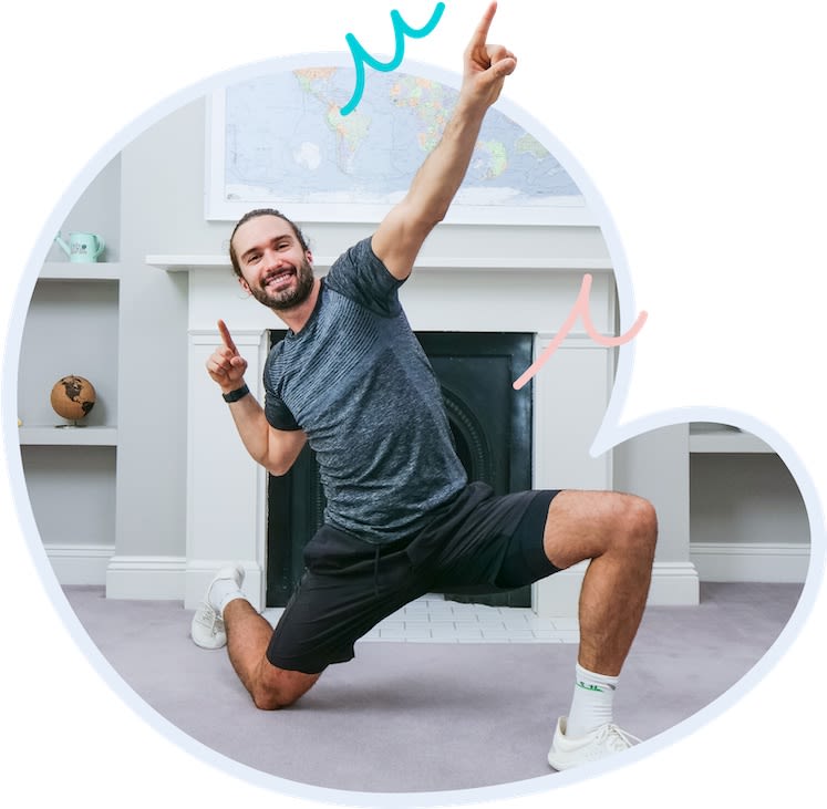 Joe Wicks kneeling down striking a pose