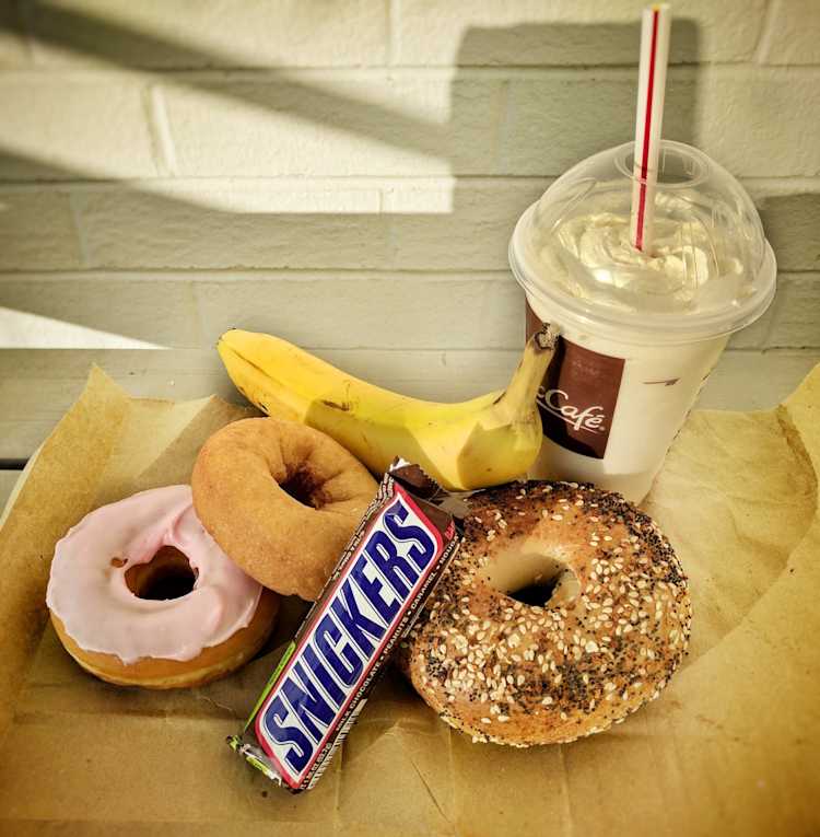 Fun facts about the above foods: (1) The banana has the “lowest calories,” but the Snickers bar is in 2nd place; the medium milkshake is the most calorically dense, tied with the donuts (2) The back of the Snickers bar boldy says, “SATISFIES” — now, why would they say that?