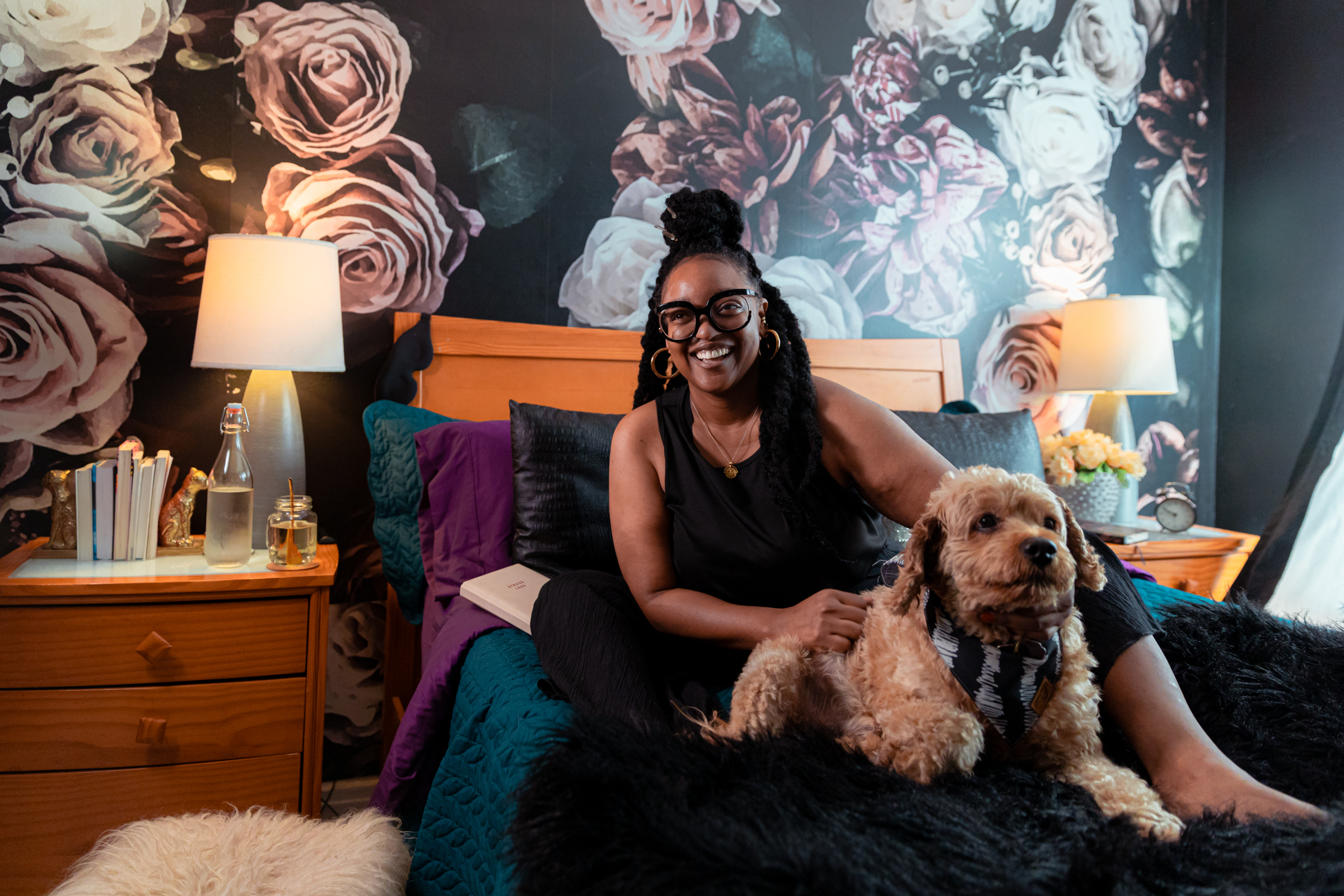 Nikki Nurse is pictured in her bedroom with her dog.
