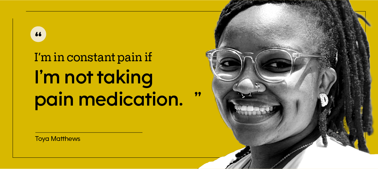 Headshot of Toya Matthews with bright red hair, outdoors