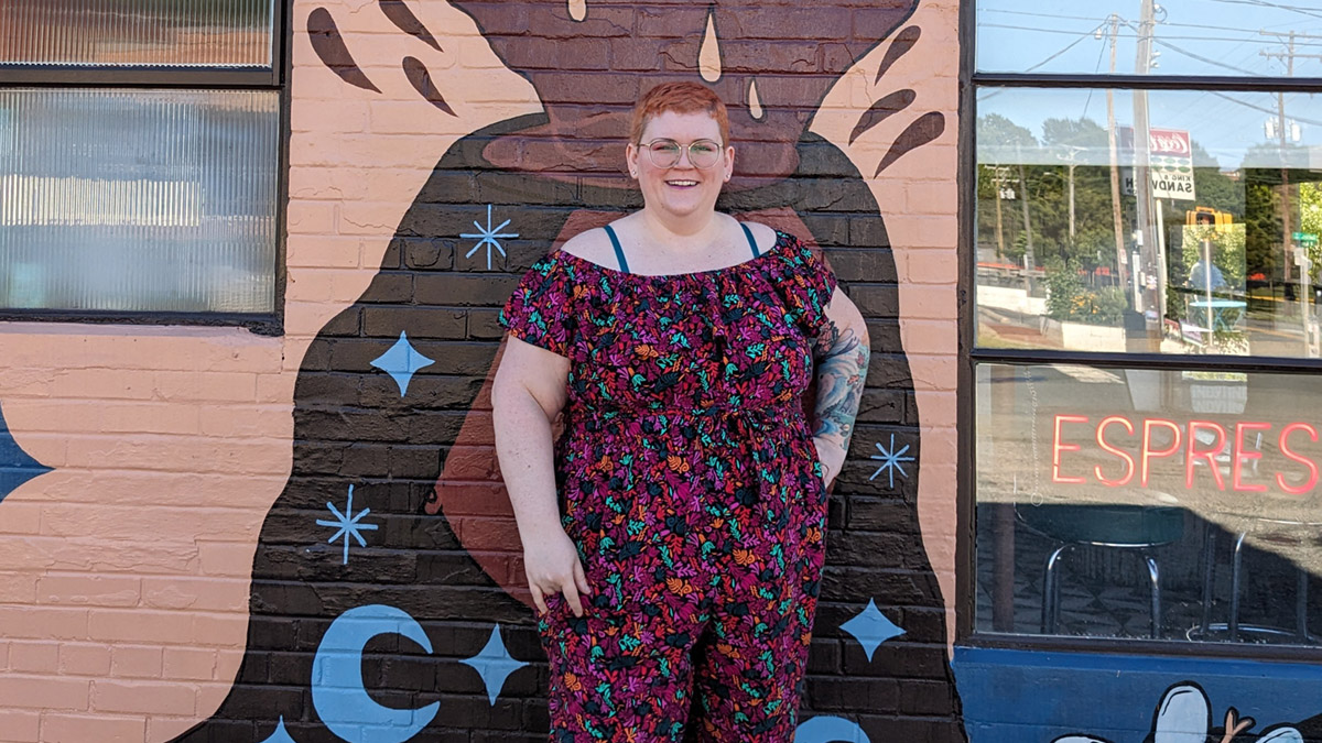 Jordan Montanez is pictured standing in front of a mural.