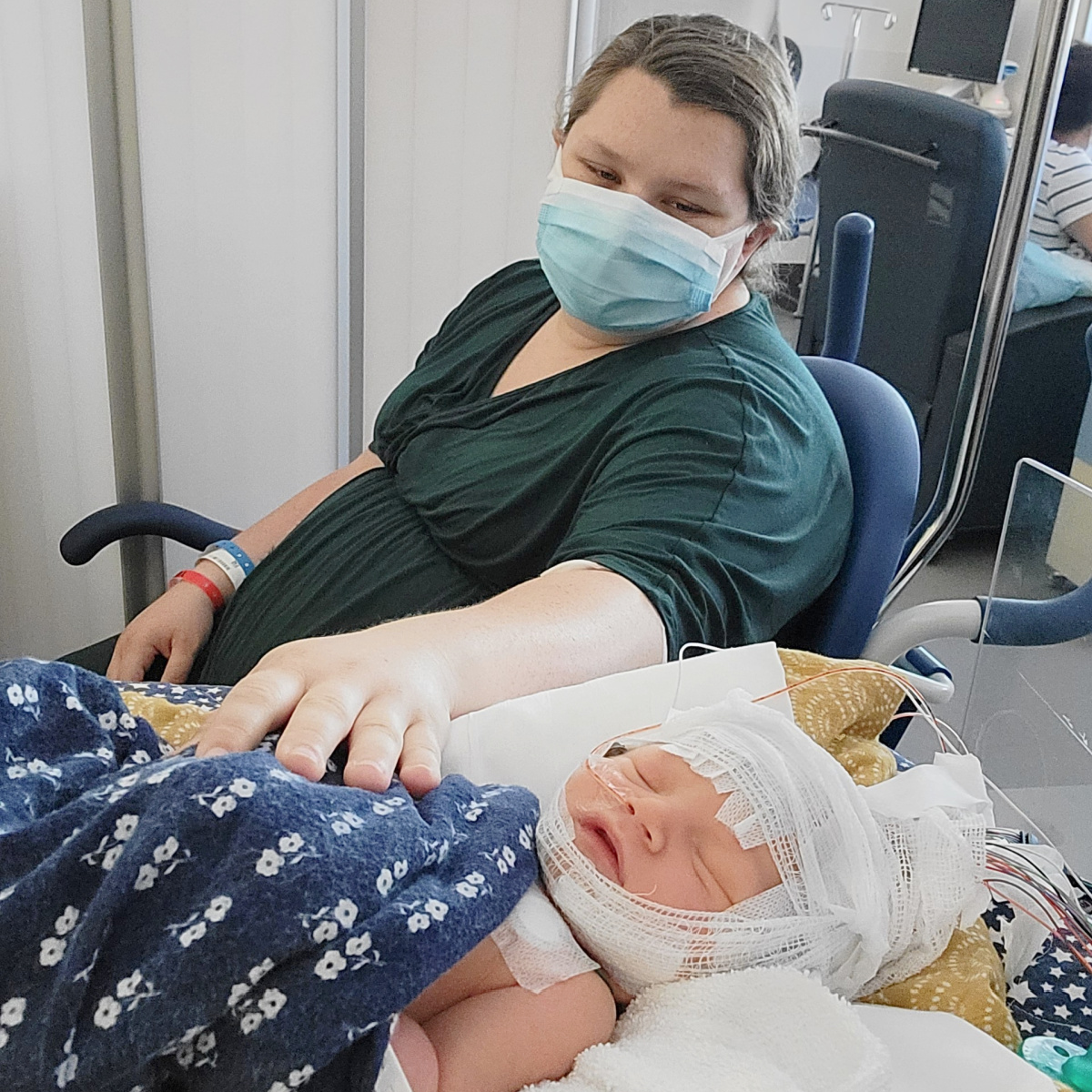 Emily Pierzina is pictured in the hospital with her newborn son.