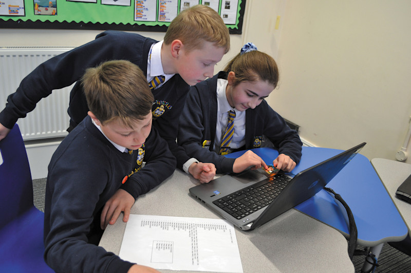 Children worked in teams to write Python code to display images and words on a micro:bit. Image credit: Shelley Howarth