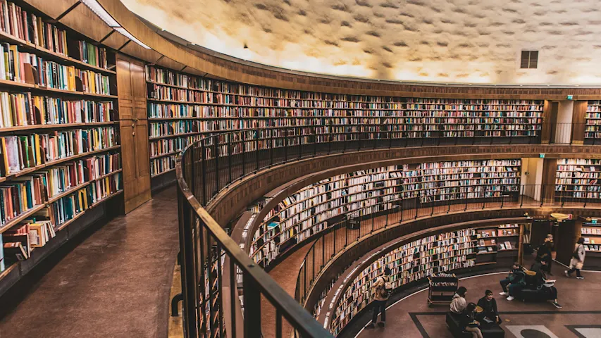 Photo of a modern public library filled with books