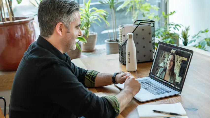 Photo of a two people in a video conference