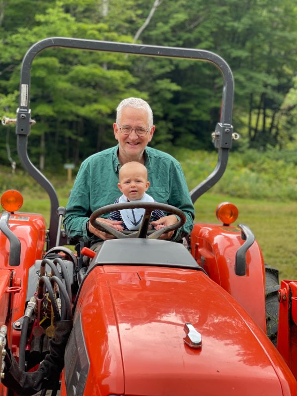 Tim Stout and Abe (grandson) on tractor