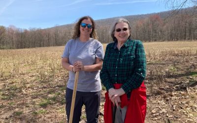Sarah Hall, National Director of Forestry for the Family Forest Carbon Program, and landowner Louise Hartman, who enrolled her Northumberland County forest in the program in the fall of 2020. Credit: Kara Holsopple / The Allegheny Front.