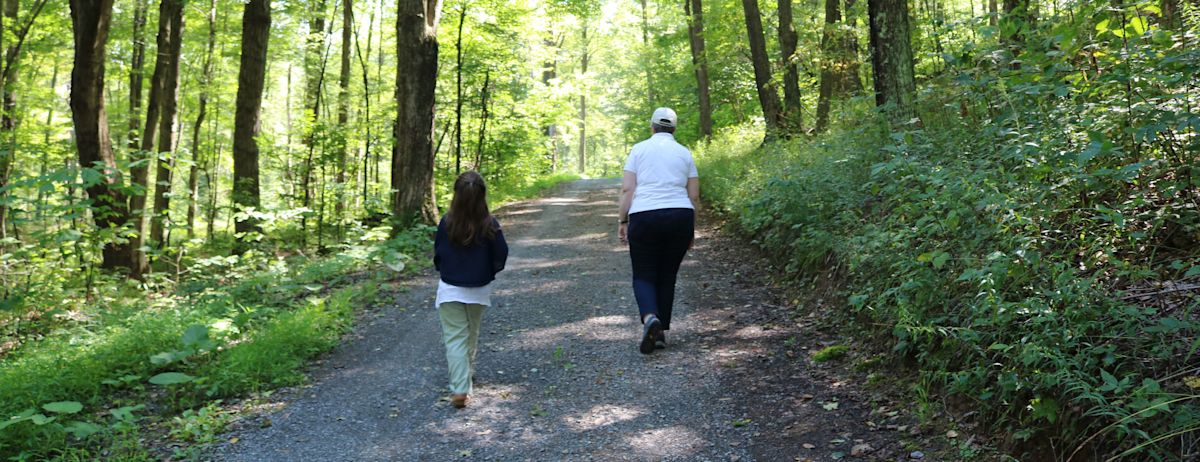 Susan Benedict (landowner, PA)-walking in woods
