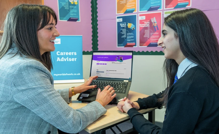 Careers adviser talking to a school pupil.
