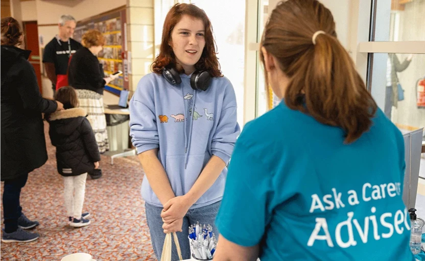 a girl speaking to a careers adviser