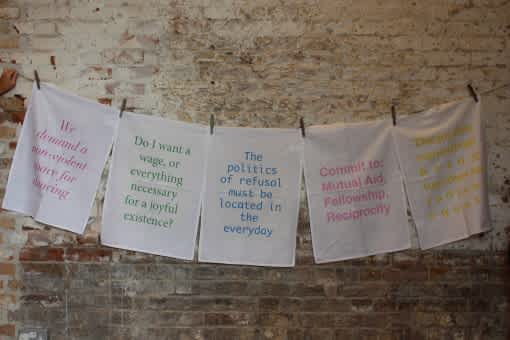 Clothesline with pieces of fabric screen-printed with political messages