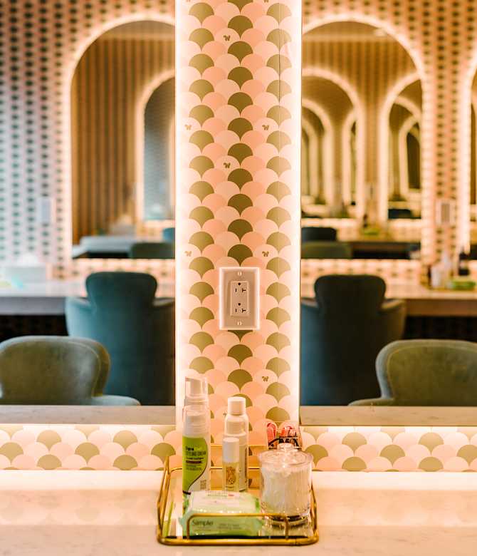 The Beauty room mirrors with custom wallpaper.