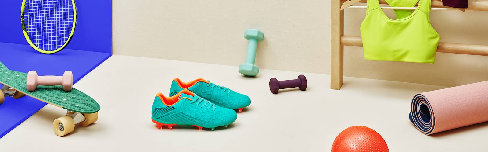 image of workout equipment- skateboard, weights tennis racket and workout clothing