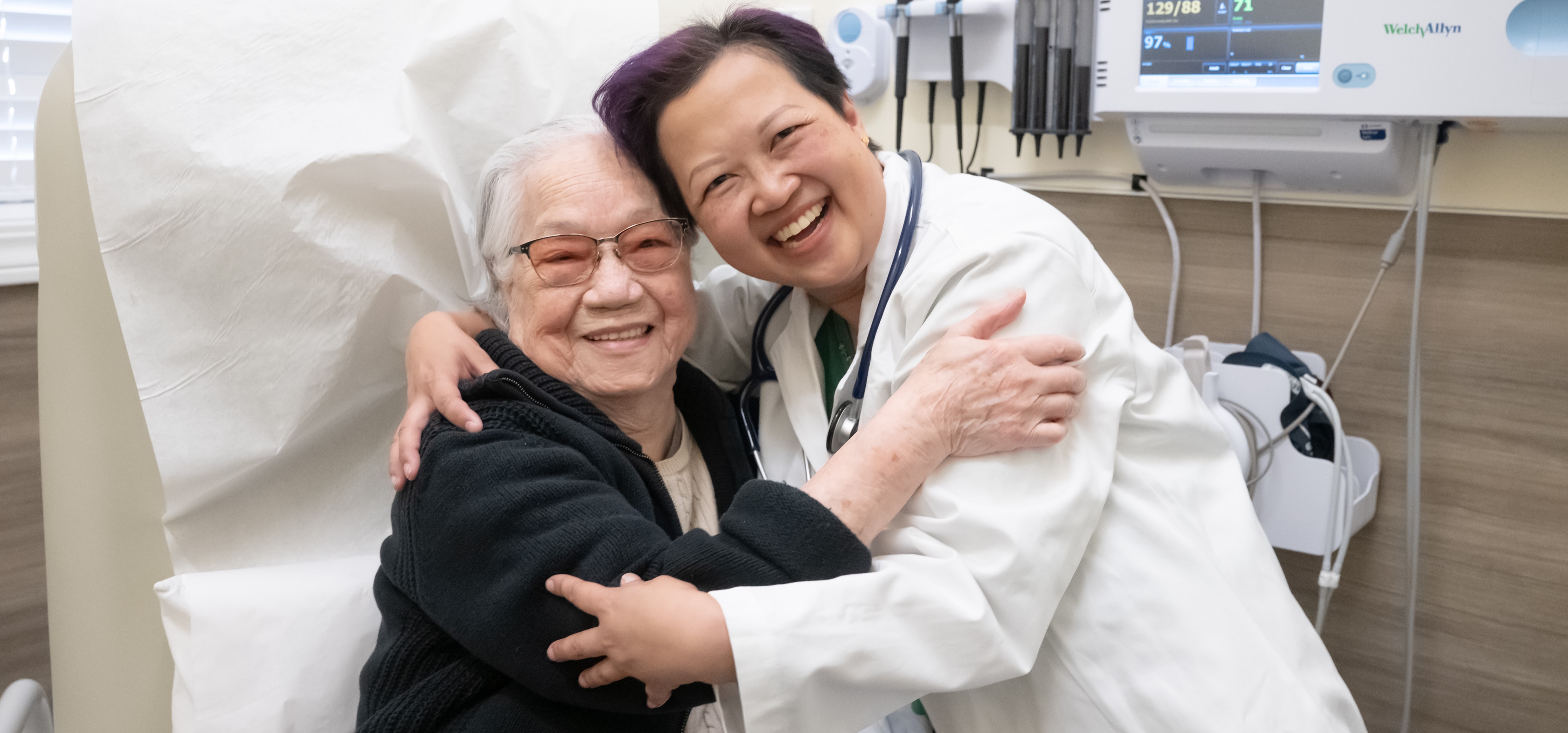 Doctor hugging patient