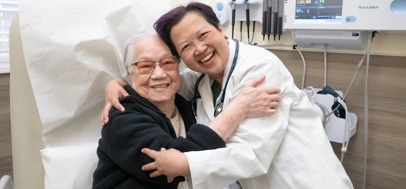 Doctor hugging patient