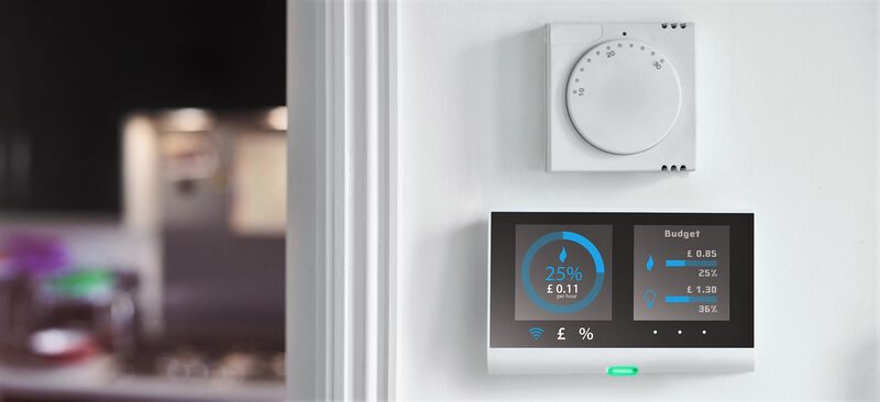 energy meter beneath a thermostat dial