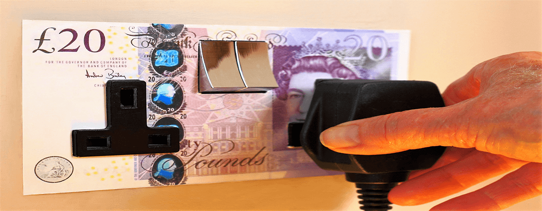 Electrical socket covered with £20 note: energy expenses