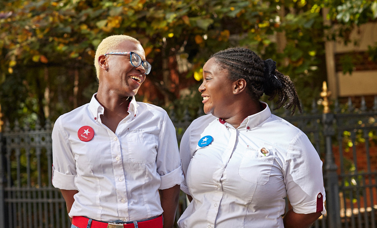 Two of Pret's Rising Stars in their Pret uniform.