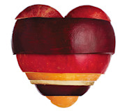 A heart image made from chopped up pieces of fruit and vegetables