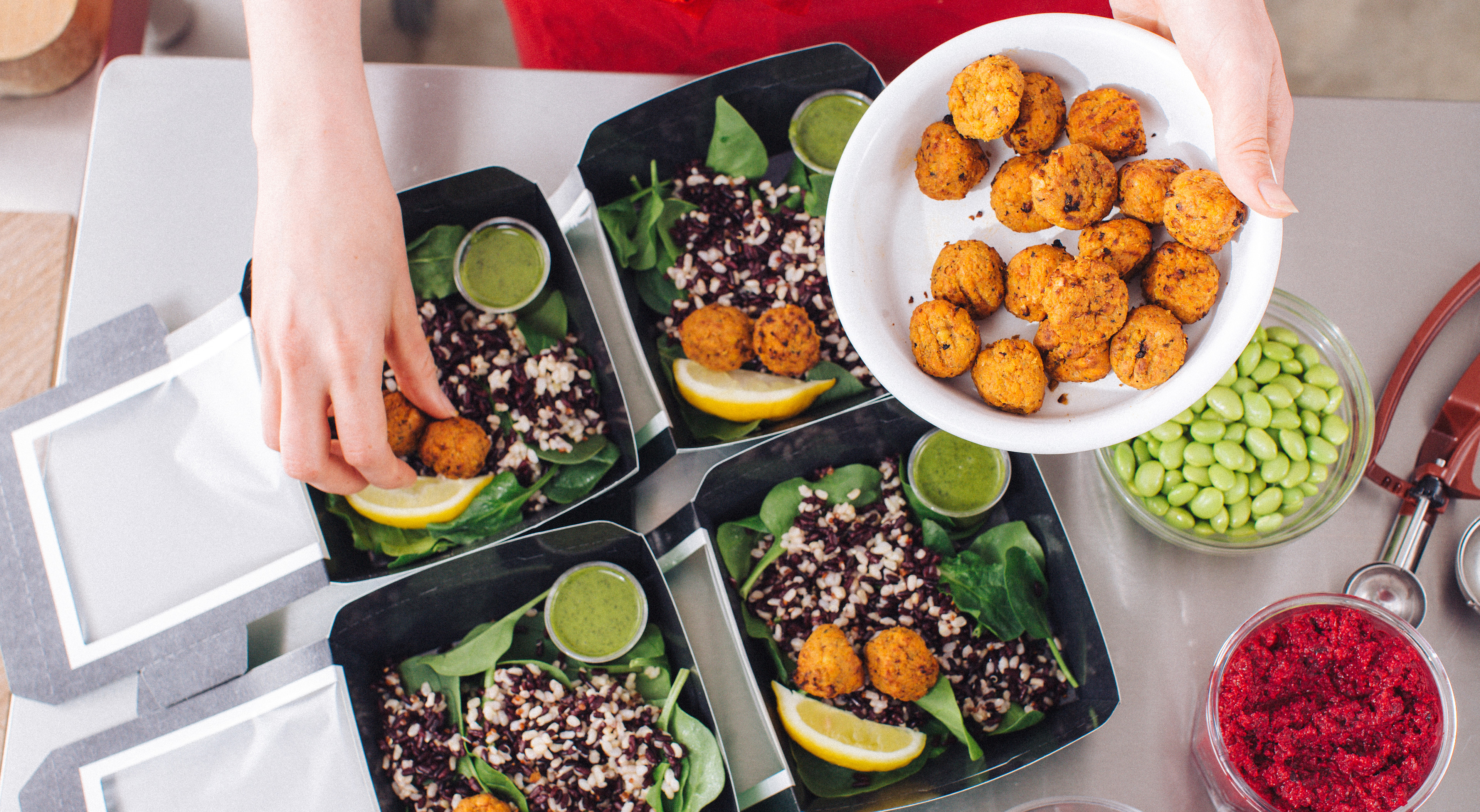 Preparing falafel salads in a Pret kitchen